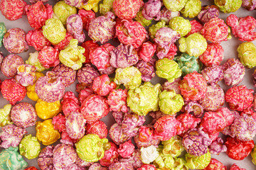 Texture of sweet colorful popcorn as background