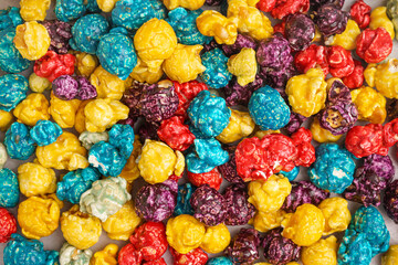 Texture of sweet colorful popcorn as background