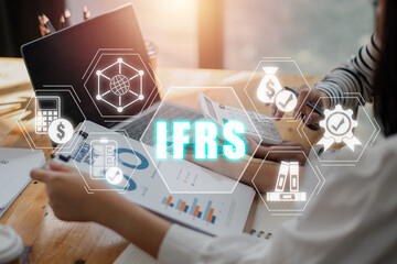 IFRS, International Financial Reporting Standards concept, Business team analyzing income charts...