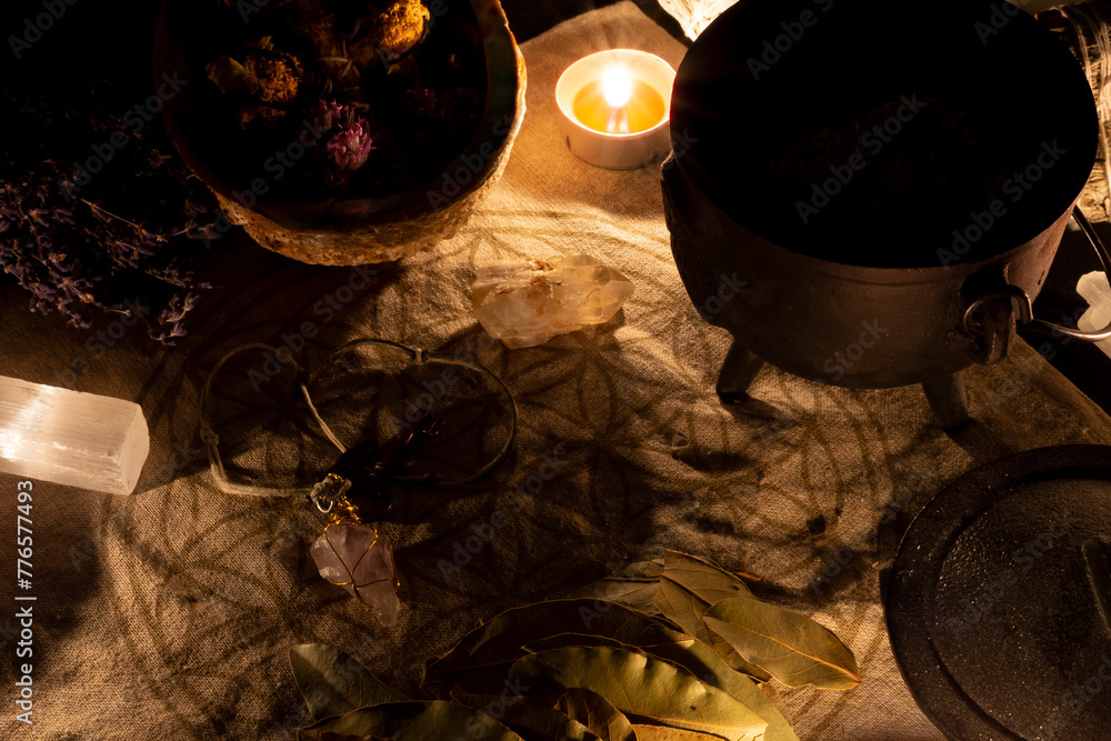 Wall mural an image of a wicca altar with candles, selenite, and dried bay leaves.