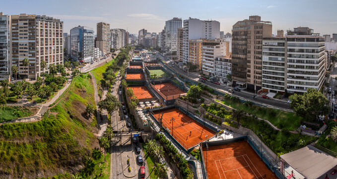 Panoramic aerial image of the heart of Miraflores, showing the buildings and a tennis club on the Bajada Balta in Lima, Peru.