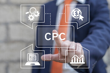 Business man using virtual touch screen presses abbreviation: CPC. Concept of CPC - Cost Per Click...