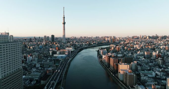 Video 4K of Sumida river and Building in Tokyo city Japan on sunrise. Tokyo is the capital of Japan. Tokyo has many tourist attractions. Japanese people are friendly. Tokyo Sky tree.