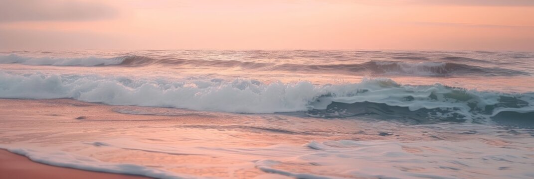 The serene beauty of a calm ocean at sunrise, where gentle waves whisper to the shore under a sky painted in soft hues of pink and orange.