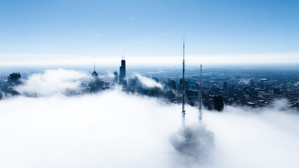 Drone view of Downtown Chicago above the clouds 