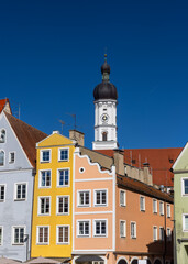 Church of the Assumption of Mary and colorful buildings in Landsberg city Germany.