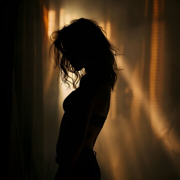 model in silhouette form outlining figure and sensuality 