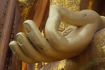 The sign of peaceful from Buddha, A hand of Buddha statue.
