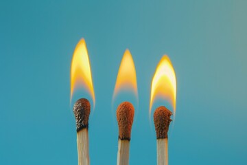 Three matches are lit and the flames are yellow