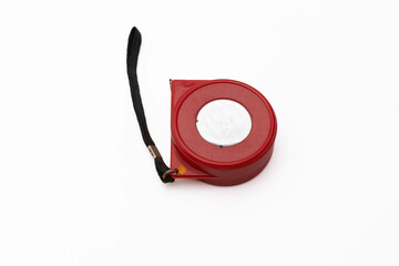 Red tape measure on white background