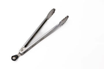 Stainless steel kitchen tongs on white background