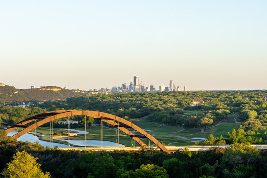 Pennybacker Bridge with downtown Austin Texas Skyline at sunset