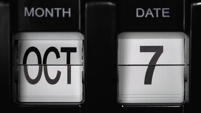 retro flip calendar with a date change from the sixth of October to the seventh of October. daily calendar with a change of days of the month. close up.