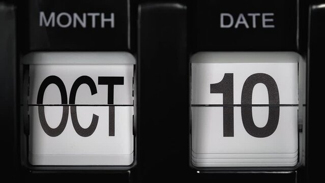 retro flip calendar with a date change from the ninth of October to the tenth of October. daily calendar with a change of days of the month. close up.