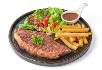 Grilled picanha steak served with fried french fries, fresh salad, tomatoes and dipping sauce...