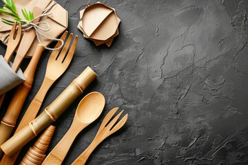 Eco Friendly Bamboo Cutlery Set with Recyclable Gift Wrap on Textured Black Surface with Copy Space