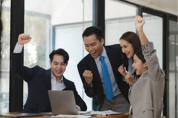 Business partners are congratulating each other on exceeding their sales targets, A group of company employees are very happy after completing a project that their boss intended.