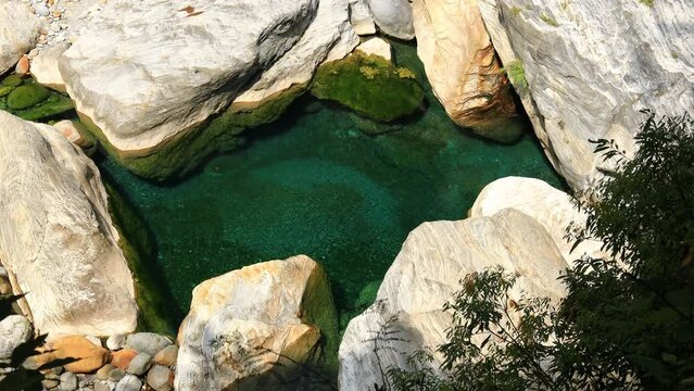 Groundwater outlet. Flowing water spray and jewel-green spring water form a scenic scene, healing video. Shakadang Trail, Taroko,Taiwan. High angle view close-up. 4k real time.