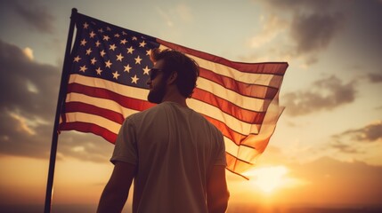 Happy man holding American Flag in the sunset sky freedom and patriotism concept - obrazy, fototapety, plakaty