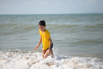 Child and person enjoying beach fun by the sea, playing and fishing in the sand on a sunny summer day - 776738082