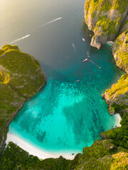 Aerial view of a tropical Maya bay beach with turquoise water and white sand