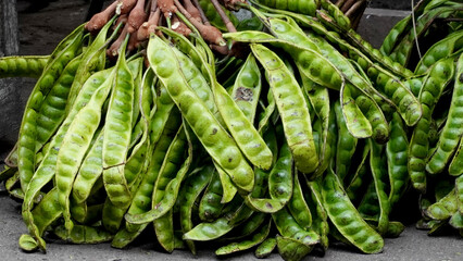 Piles of petai, a vegetable that Indonesians usually use as fresh vegetables, even though they make...