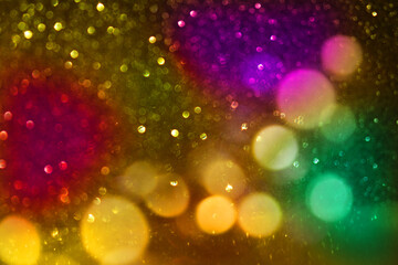 Magic background with golden bokeh with  colorful purple pink yellow. Frame from golden shiny...