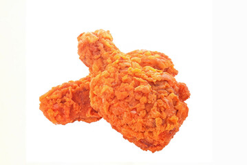 Isolated fried chicken wings and legs on a white plate, ready for a delicious mealIsolated fish on a white background, crispy and delicious