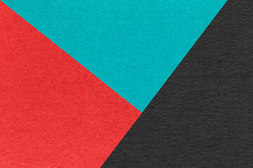 Texture of craft red, turquoise and black paper background, macro. Vintage abstract cerulean...