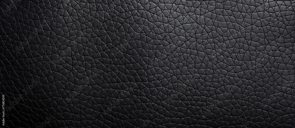 Poster luxurious black leather background featuring a sophisticated pattern of small squares, adding an ele
