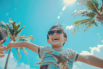 Joyful child playing under sunny skies with palm trees in the background.