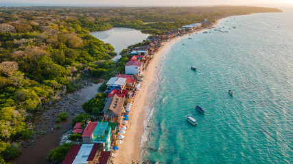 Aerial view of Playa Blanca, Baru, showcasing the pristine beach, turquoise waters, and colorful...