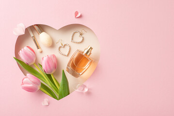 Mother's Day glamour top view shot: Fresh tulips, perfume, makeup essentials, jewelry, and paper...