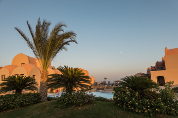 Fototapeta na wymiar view over a resort in egypt with palm trees houses and pools at the red sea