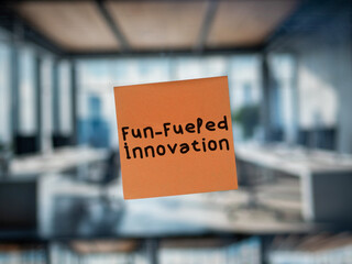 Post note on glass with 'Fun-Fueled Innovation'.
