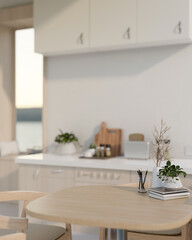 An empty space for display products on a wooden dining table in a contemporary, minimalist kitchen.