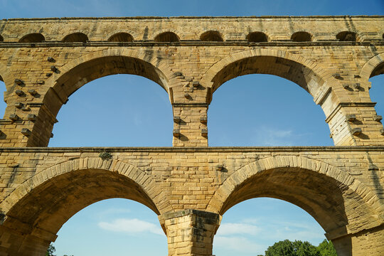 Pont du Gard famous aqueduct arched bridge close-up view, popular tourist landmark in France
