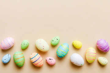decorative easter eggs on colored background. easter eggs collection top view with copy space