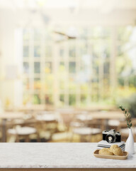 A dining table in a restaurant or coffee shop with a view from a garden on a sunny day.