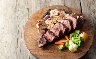 grilled beef steak with roasted garlic	
