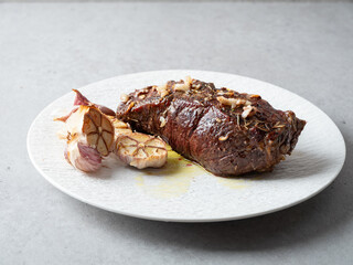 grilled beef steak with roasted garlic