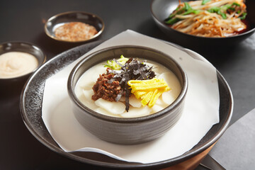tteokguk, rice-cake soup prepared with slices of rice cake, beef, eggs, etc.