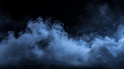 Mystical blue smoke. Wisps of smoke rising from the ground on a dark background, suitable for spooky or atmospheric themes.