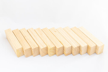 A long line of wooden uneven rectangular cubes isolated on white background. Blank cubes with space for text,