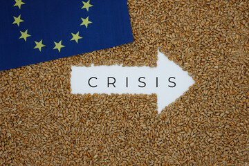 Wheat. Right Arrow. The word Crisis. Grain background.  European Union flag. Grain crisis.
