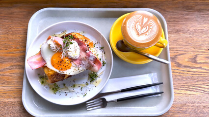 Fast food includes omelets, vegetables, bacon with latte, Kyoto, Japan, Dec 2023