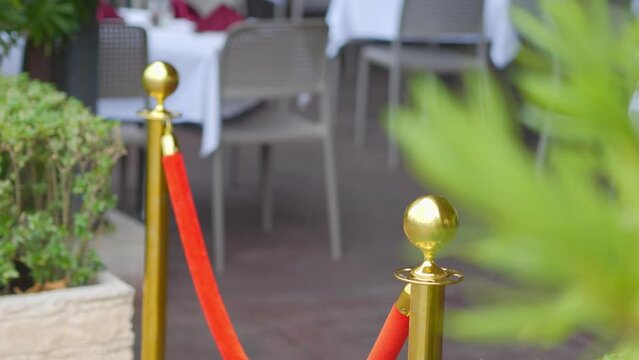 Luxurious velvet and golden rope barrier at an elegant event in 4k slow motion 120fps