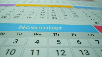 Calendar. Macro shot of important date in the calendar. 2022, 2023, 2024 year. Holidays and business days. June, July, September