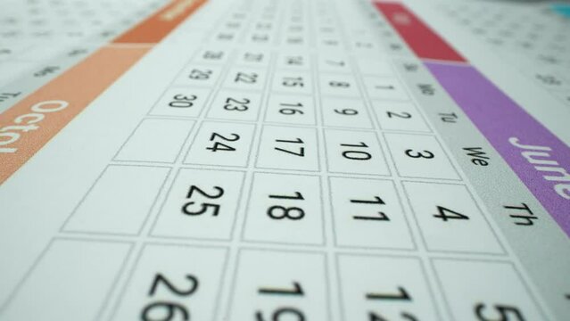 Very important date in the calendar. Signing a day on a calendar. Calendar date of the month cut. Macro shot of dates June 2024. Close-up