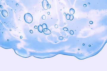 Liquid gel or serum on a screen of microscope blue green  reflected background with bubbles